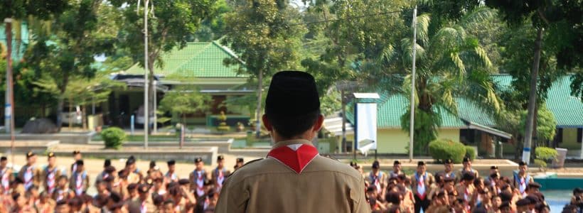 a man standing in front of a large group of people